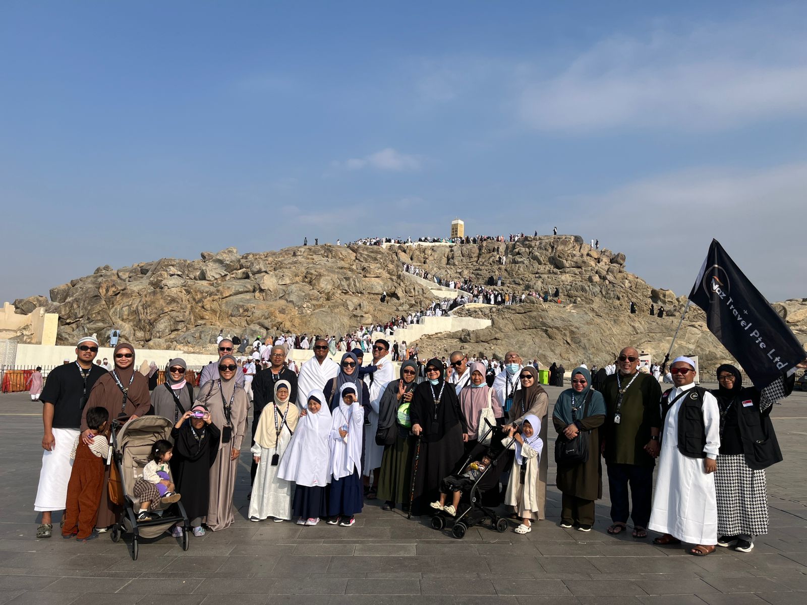 Naz Travel flag raised at a sacred site