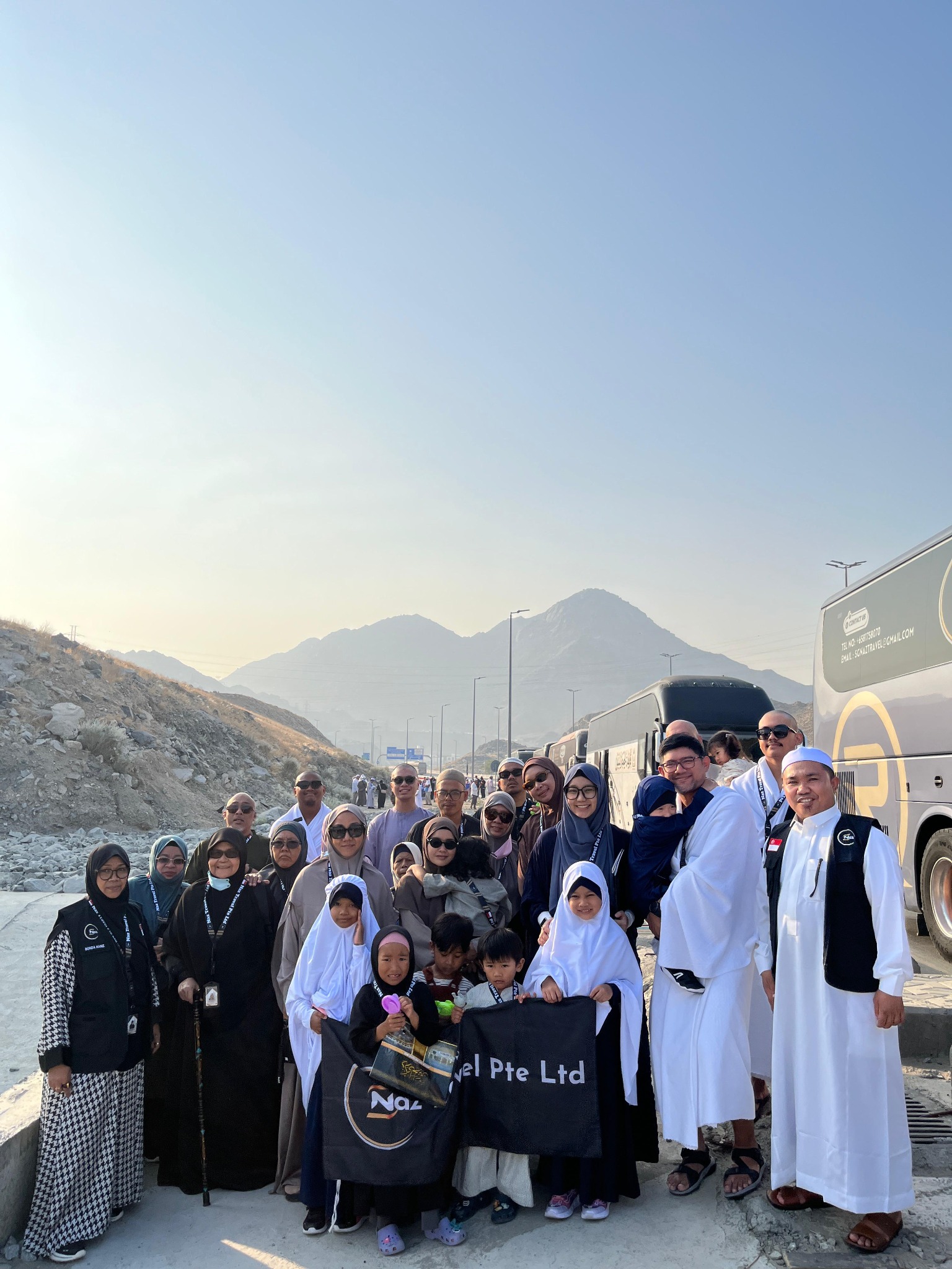 Naz Travel group photo with mountains in the background